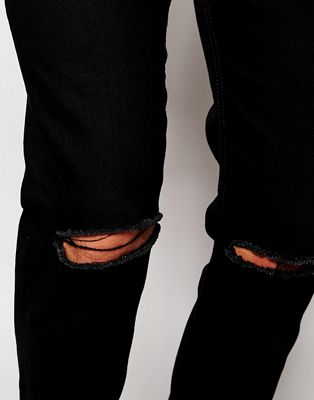 stretch black ripped jeans