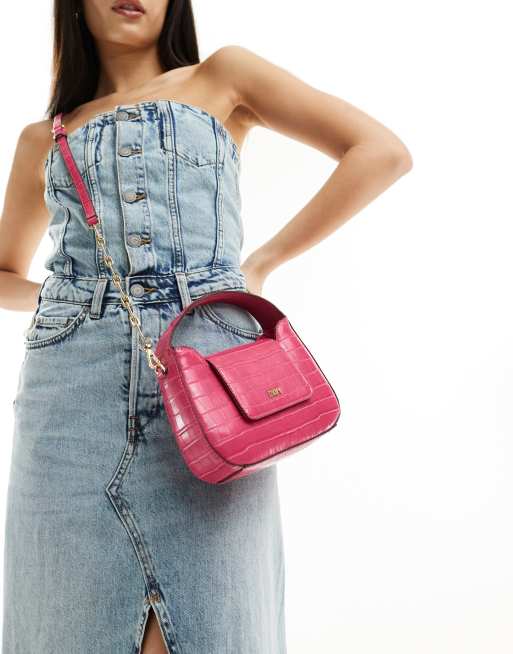 DKNY Arden top handle bag with cross body strap in pink croc ASOS