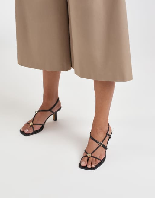 Dolce Vita Mylee strappy mid heel sandals with gold hardware in black leather, 4 of 4