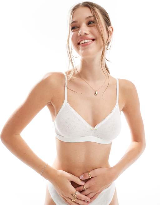 Dorina - Ajourgebreide bralette zonder vulling met roze rozenknopdetail in ivoorwit