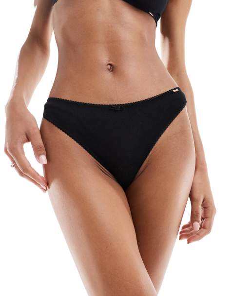Dorina – Pointelle-Tangaslip in Schwarz mit Rosenknospendetail - view 1