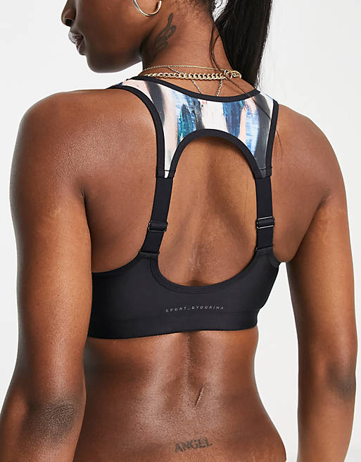 Dorina Powell lightly padded zip front sports bra in abstract print