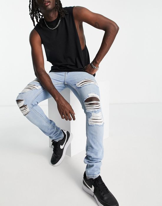https://images.asos-media.com/products/dr-denim-chase-skinny-jeans-with-extreme-rips-in-light-wash/203056711-1-lightwash?$n_550w$&wid=550&fit=constrain