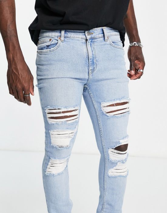 https://images.asos-media.com/products/dr-denim-chase-skinny-jeans-with-extreme-rips-in-light-wash/203056711-2?$n_550w$&wid=550&fit=constrain