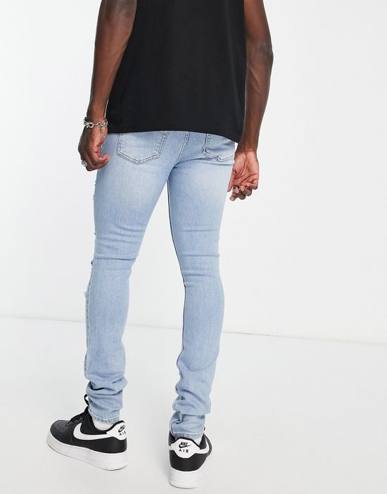 https://images.asos-media.com/products/dr-denim-chase-skinny-jeans-with-extreme-rips-in-light-wash/203056711-3?$n_550w$&wid=550&fit=constrain