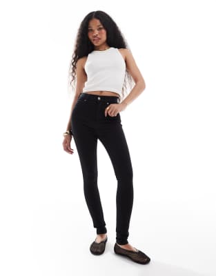 Dr. Denim Petite - Moxy - Eng geschnittene Jeans in Schwarz mit mittelhohem Bund