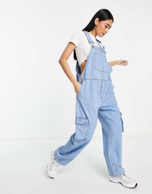 Monki relaxed dungarees with contrast detail in light wash denim