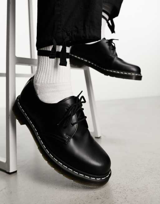 Dr Martens black shoe with white stitch