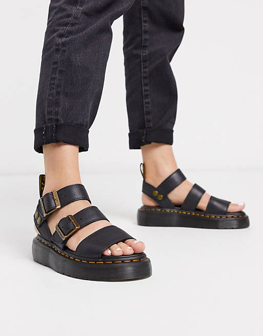 Dr Martens - Gryphon Quad - Leren sandalen met dikke zool en goudkleurig metaalwerk in zwart