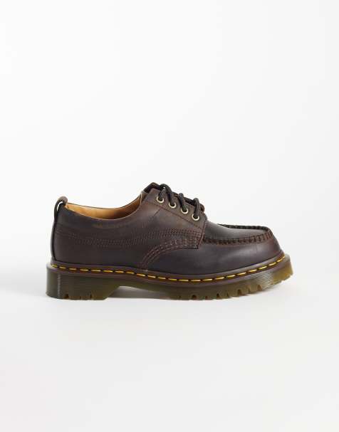 Dr Martens – Lowell 4 – Mörkbruna skor i unisex-modell med öljetter - view 1