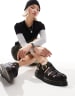Dr Martens Wrenlie quad caged sandals in black | ASOS