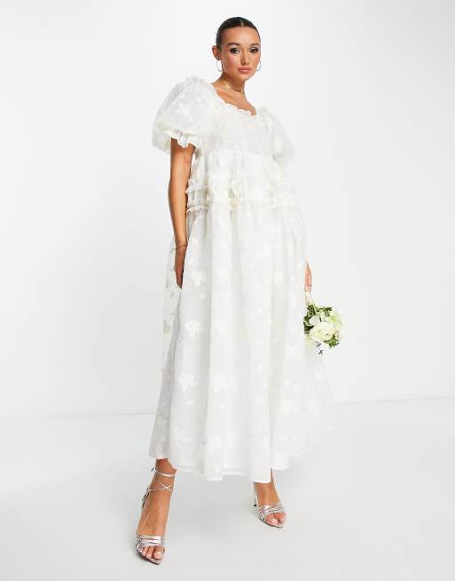 Dream Sister Jane - Bruidskleding - Lange jurk van organza met pofmouwen en bloemenprint in wit