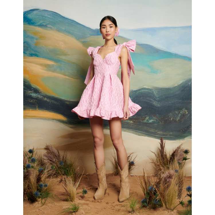 Dream Sister Jane jacquard bow ruffle hem mini dress in pink | ASOS