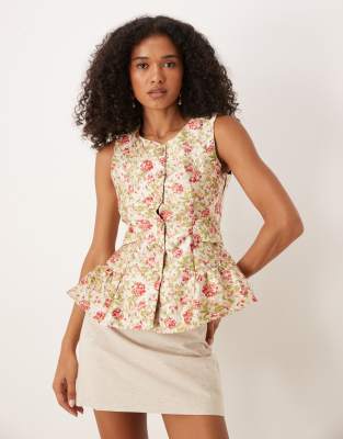 Dream Sister Jane - Schößchenoberteil mit Jacquard-Blumenmuster und Schleife am Rücken-Bunt