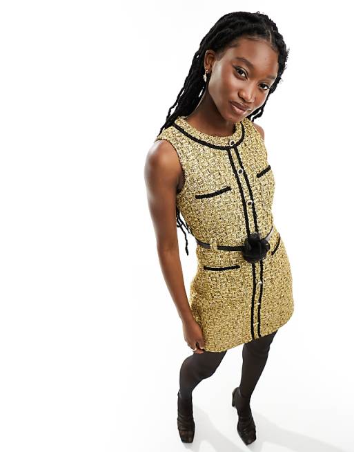 gold tweed dress Elina Boucle / L Boucle wool blend tweed with fringe Fully lined (100% polyester) Button closure at front body Pockets at hips 7/8 length slim sleeve Above the knee length (35.5 HPS) Dry clean only Toasty Tweed Dress