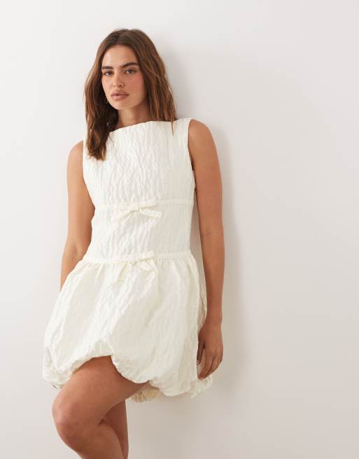 Dream Sister Vitsippa jacquard boat neck sleeveless bubble hem mini dress in ivory, 2 of 4