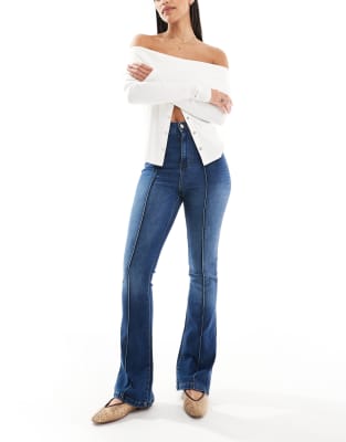 DTT Bianca high waist flared jeans with front seam and heart pocket detail in mid blue