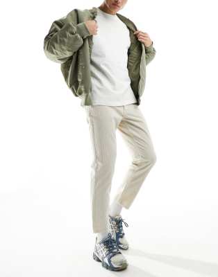 Don't Think Twice DTT cropped tapered fit cord trousers in ecru-White