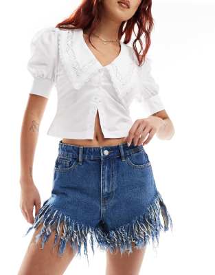 Don't Think Twice DTT extreme frayed festival denim shorts in mid blue