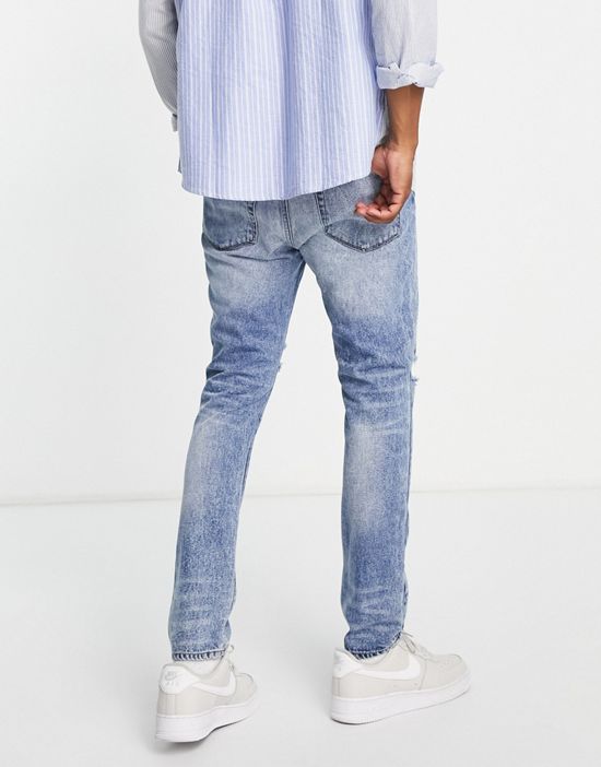 https://images.asos-media.com/products/dtt-extreme-rip-jeans-in-vintage-light-blue/202261900-2?$n_550w$&wid=550&fit=constrain