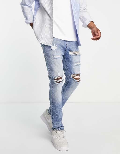 DTT rigid tapered fit ripped jeans in mid blue