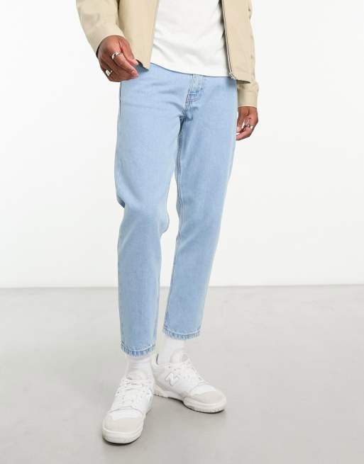 DTT – Feste, schmal zulaufende Jeans in hellblauer Stone-Waschung mit verkürztem Schnitt