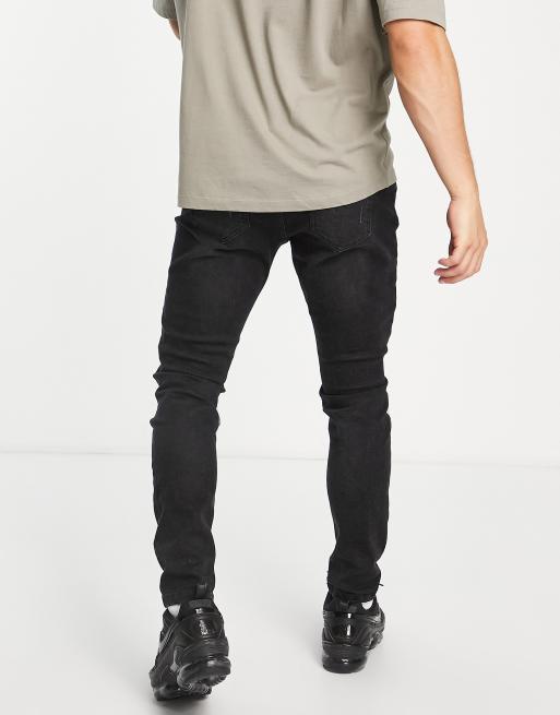 DTT – Jeans in verwaschenem Schwarz mit engem Schnitt und geflickten Rissen , 2 von 4