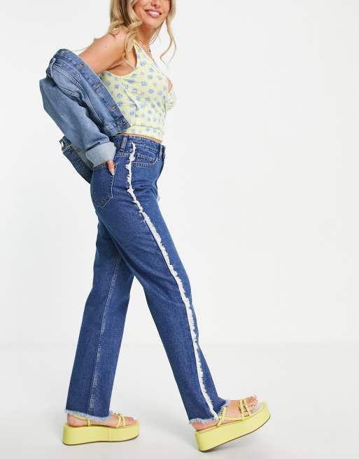 Side sales frayed jeans