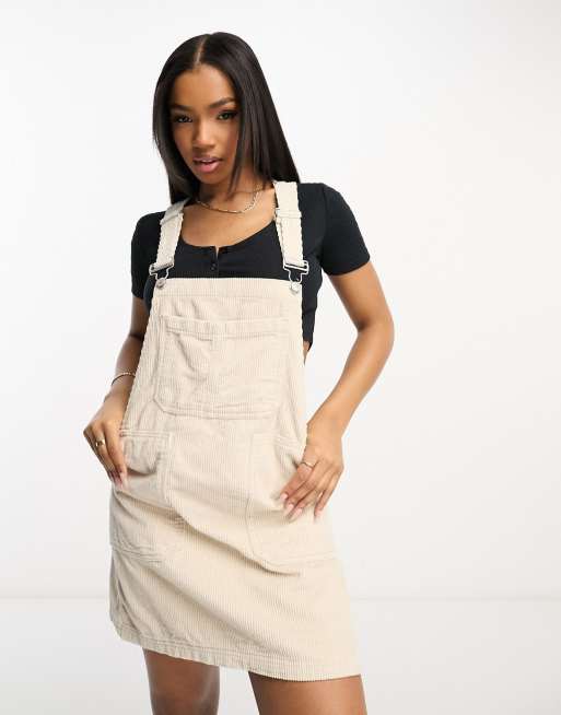 DTT Lucine cord pinafore dress with pockets in ecru