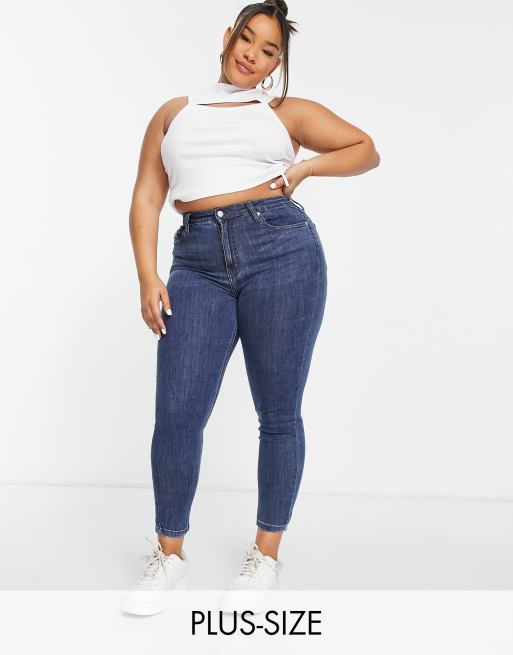 DTT Plus – Jo – Jeans mit mittelhohem Bund und engem Schnitt in verwaschenem Mittelblau  