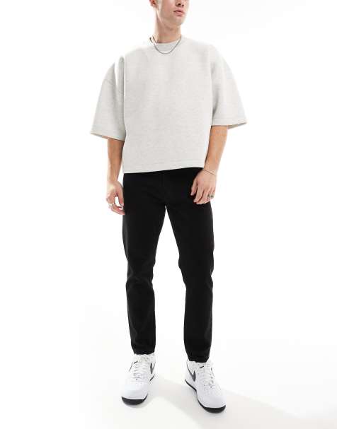 DTT rigid cropped tapered fit jeans in black - view 1