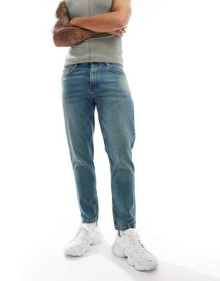 DTT rigid cropped tapered fit jeans in mid blue vintage tint