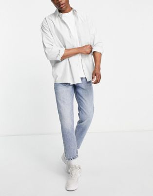 DTT rigid cropped tapered fit jeans in vintage light blue