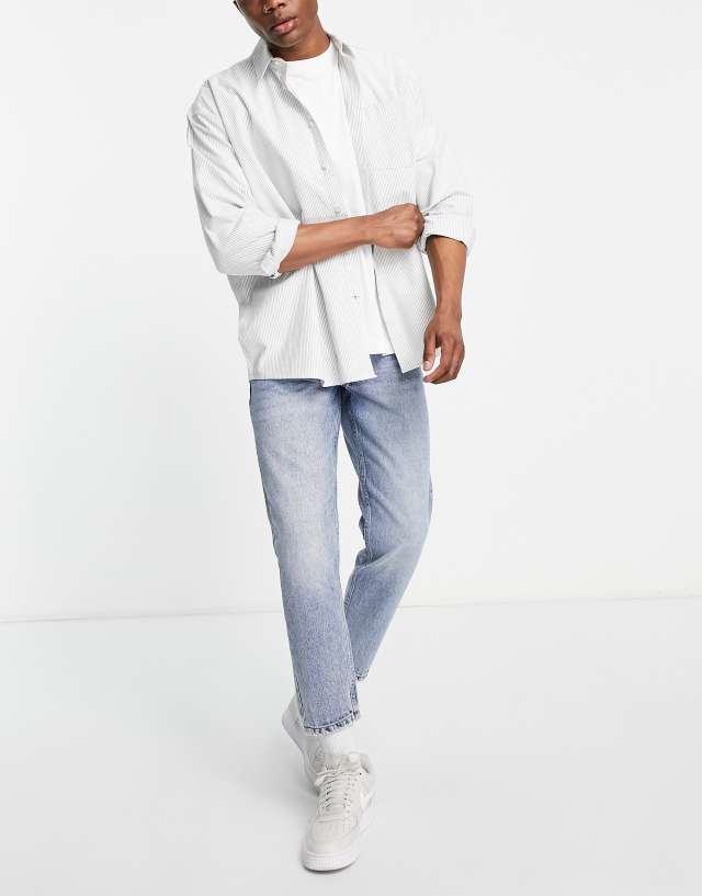 DTT rigid tapered fit jeans in vintage light blue