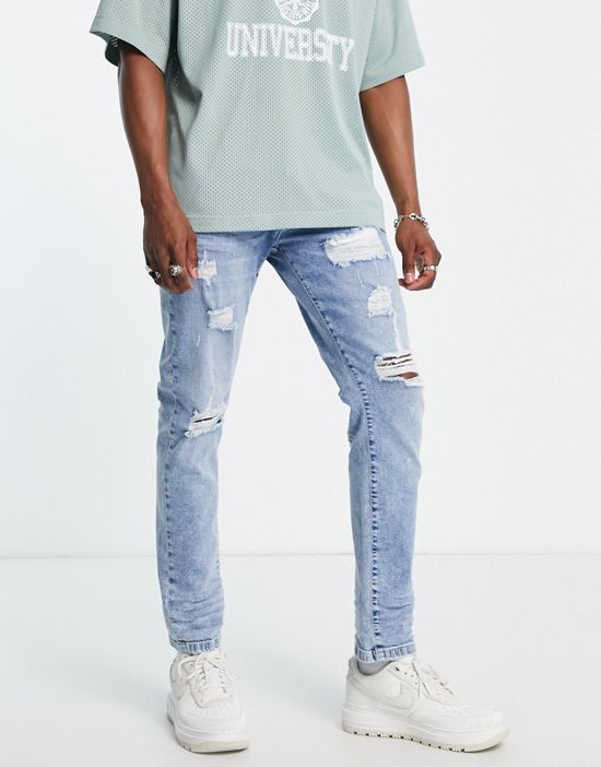 https://images.asos-media.com/products/dtt-slim-fit-extreme-rip-jeans-in-light-blue/202261846-1-blue?$n_550w$&wid=550&fit=constrain