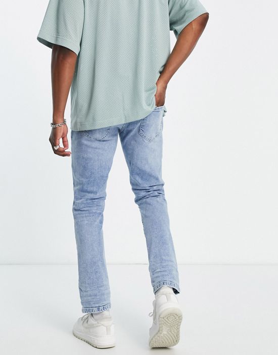 https://images.asos-media.com/products/dtt-slim-fit-extreme-rip-jeans-in-light-blue/202261846-2?$n_550w$&wid=550&fit=constrain