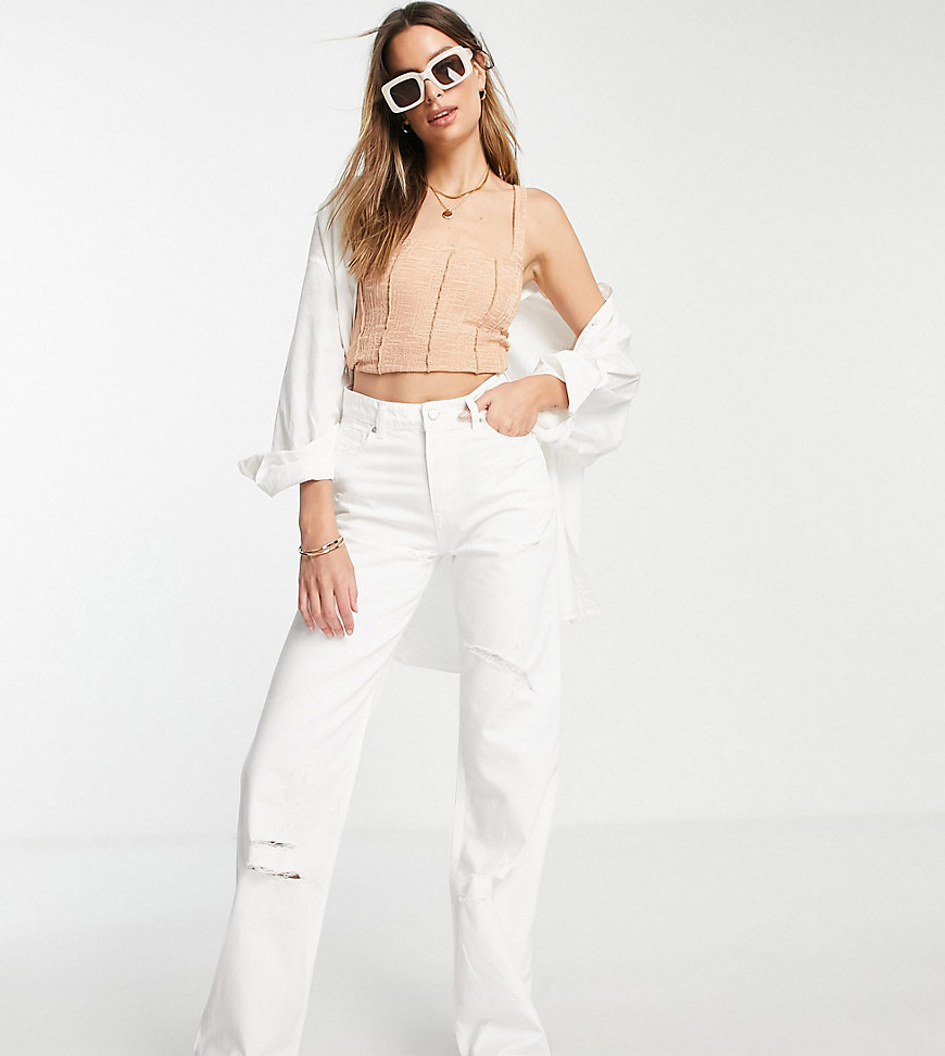 DTT Tall straight leg jeans with raw hem and knee rips in white