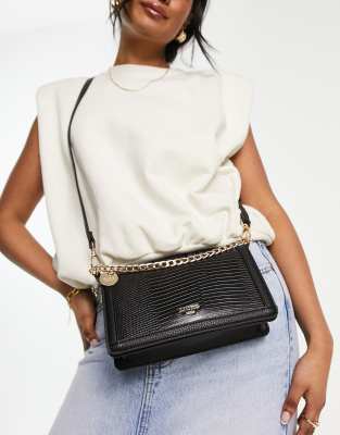 Dune chain detail cross body bag in black mock lizard