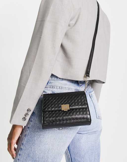 Dune flap over crossbody bag in black ASOS