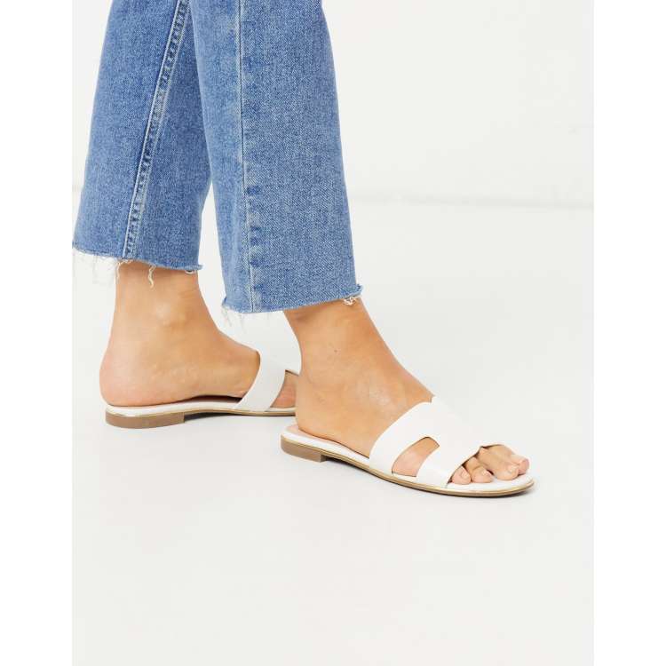 Dune London loopy slip on flat sandals in white