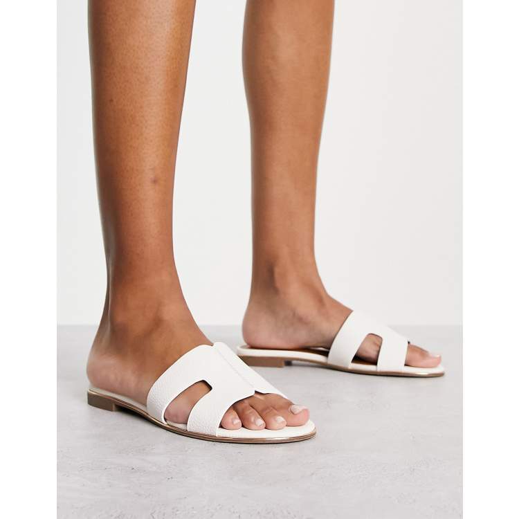 Dune London loopy slip on flat sandals in white ASOS