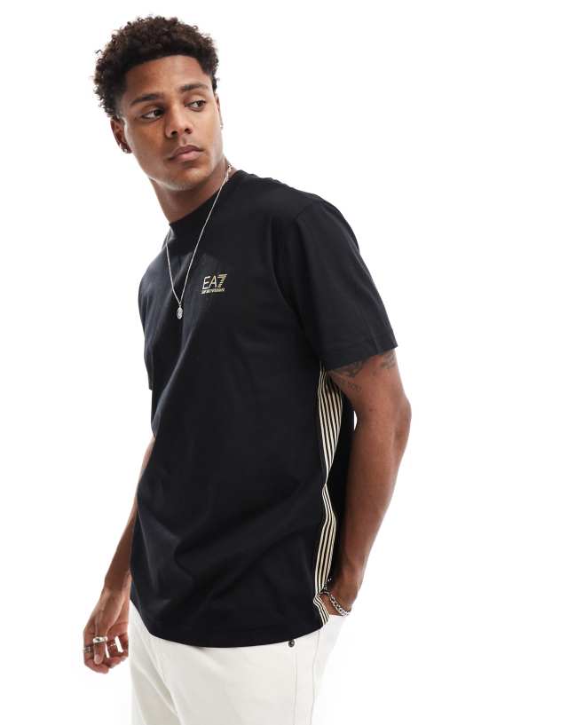 EA7 - t-shirt in black with gold logo and side stripes