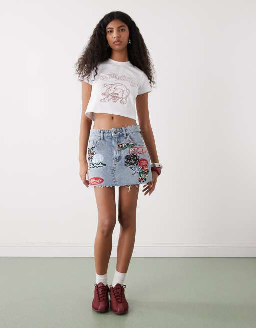 Ed Hardy multi badge tattoo denim mini skirt in mid blue, 2 of 5