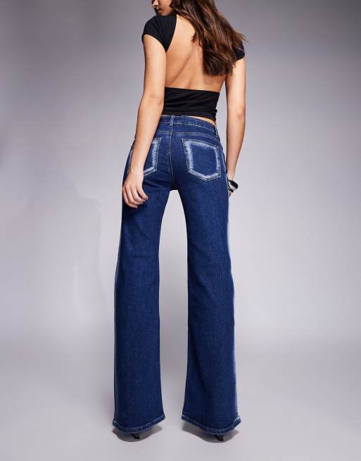 Edikted Airbrushed low rise flared jeans in dark blue washed, 2 of 5