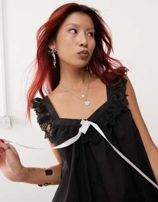 Edikted babydoll smock frill mini dress with white contrast ribbon in black