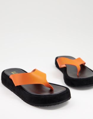 Ego Bayside chunky flip flops in orange - ASOS Price Checker