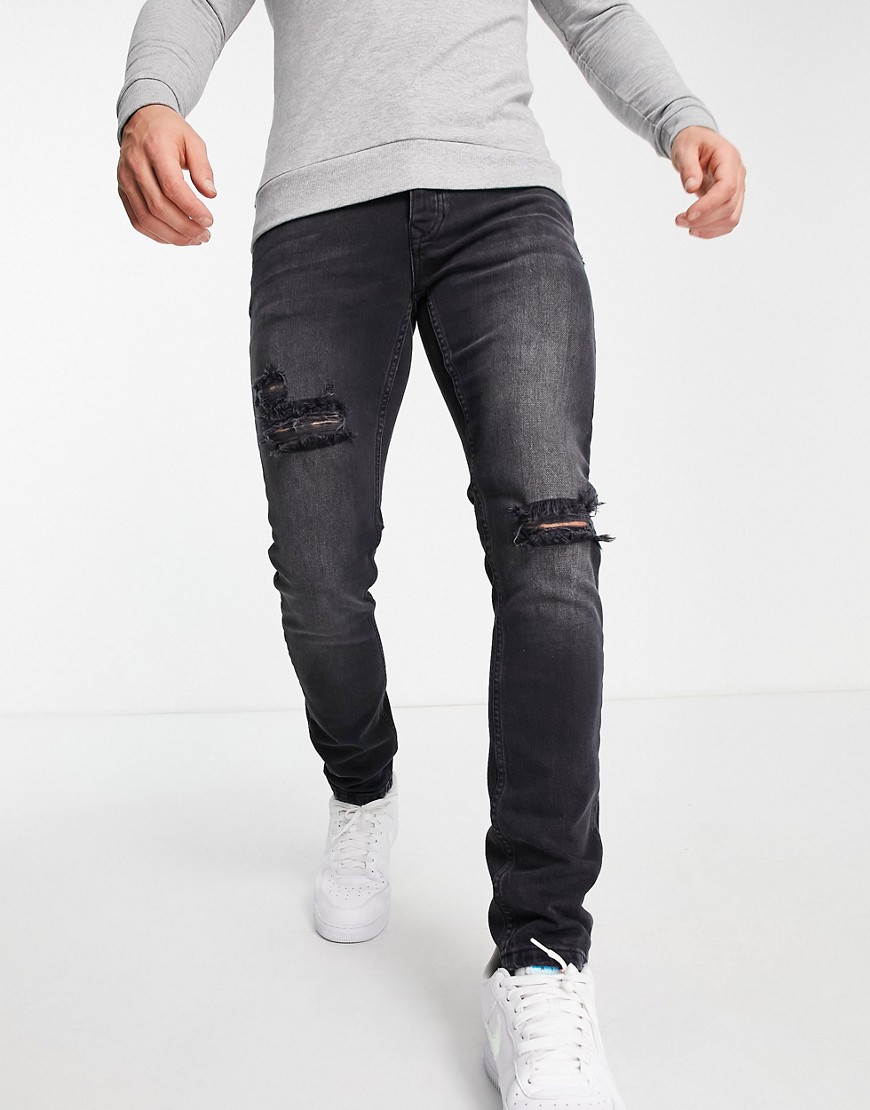 фото Эластичные зауженные джинсы черного выбеленного цвета со рваной отделкой topman-черный цвет