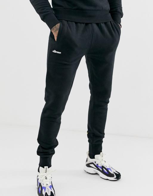 ellesse Aro sweatpants with multi logo in black | ASOS