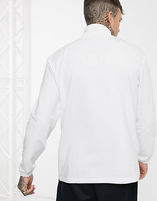 ellesse Avisio half-zip logo sweat in white | ASOS