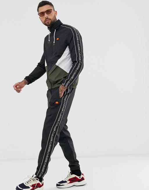 ellesse Bandino track pants with taping in black